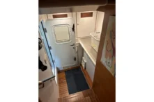 2016 Nordhavn 60 - CHOICES - Utility room entry with watertight door and teak sole