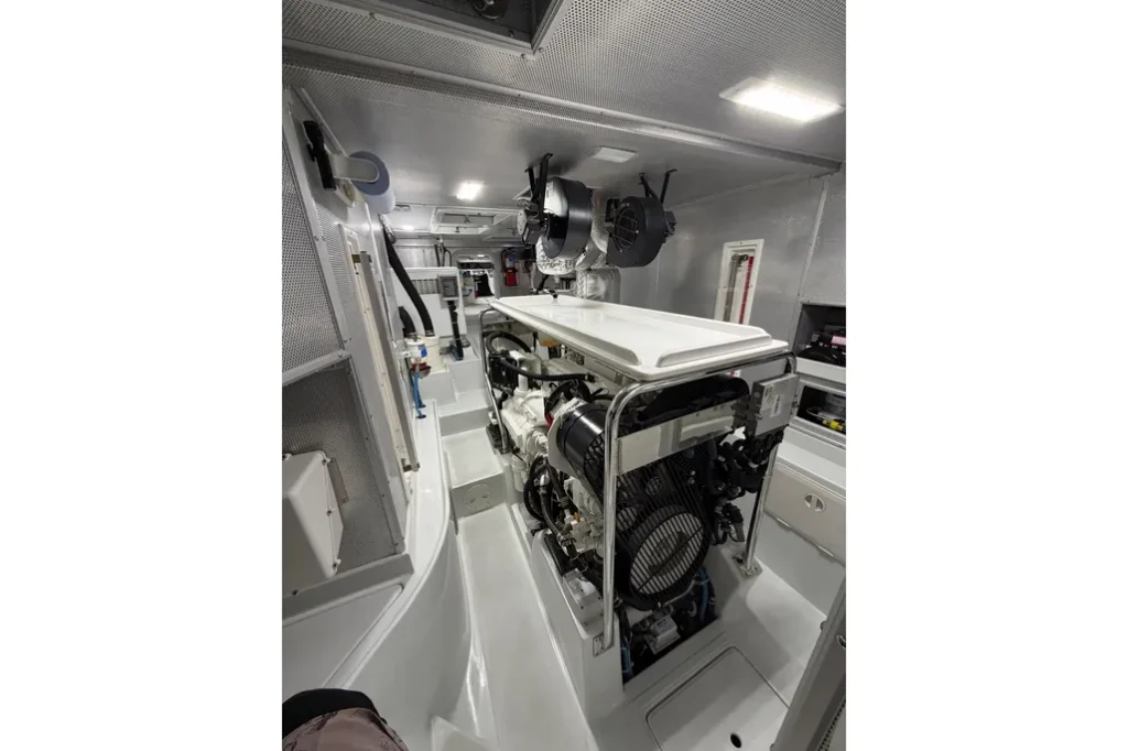 2016 Nordhavn 52 - Aleoli - Engine room showing John Deere 6068 main engine with dry-stack exhaust and Northern Lights generator forward