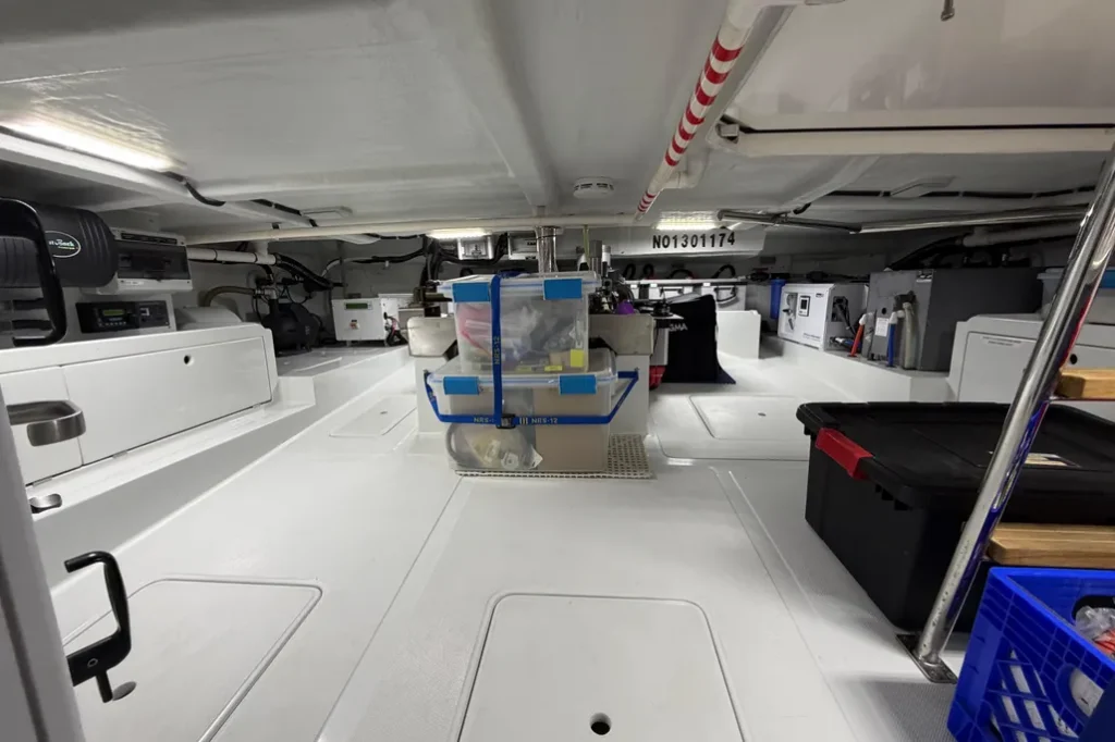 2016 Nordhavn 52 - Aleoli - Below-deck systems space with Village Marine water maker, inverters, electrical systems, and storage