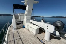 2016 Nordhavn 52 - Aleoli - Aft deck with Steelhead ES1500 davit, AB tender with Yamaha outboard, and flybridge ladder