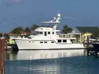 2011 Nordhavn 60 Trawler ONYXIA docked at the marina under a clear blue sky