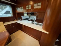 2011 Nordhavn 60 Trawler ONYXIA galley with wood cabinetry and modern appliances