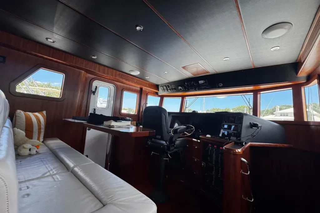 2025 Nordhavn 475 Listo upper pilothouse helm with full electronics suite and wraparound windows