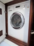 2011 Nordhavn 60 Trawler ONYXIA washer and dryer enclosed in a wood cabinet