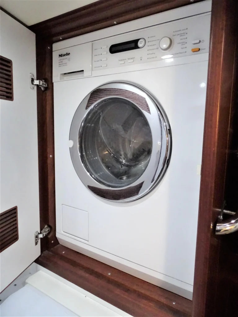 2011 Nordhavn 60 Trawler ONYXIA washer and dryer enclosed in a wood cabinet