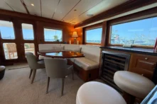 2006 Nordhavn 64 - KARIWA 7 - Luxurious 2006 Nordhavn 64 yacht interior with elegant dining area and panoramic windows.