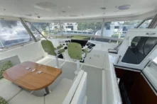 2006 Nordhavn 64 - KARIWA 25 - Pilothouse of 2006 Nordhavn 64 yacht with dual helm seats and panoramic windows.