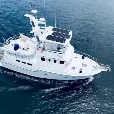 2003 Nordhavn 47 - SWEET DEBBIE 1 - Nordhavn 47 yacht from 2003 cruising on open water, featuring solar panels.