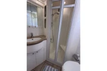 2003 Nordhavn 47 - SWEET DEBBIE 13 - Bathroom interior of 2003 Nordhavn 47 yacht with shower and vanity.