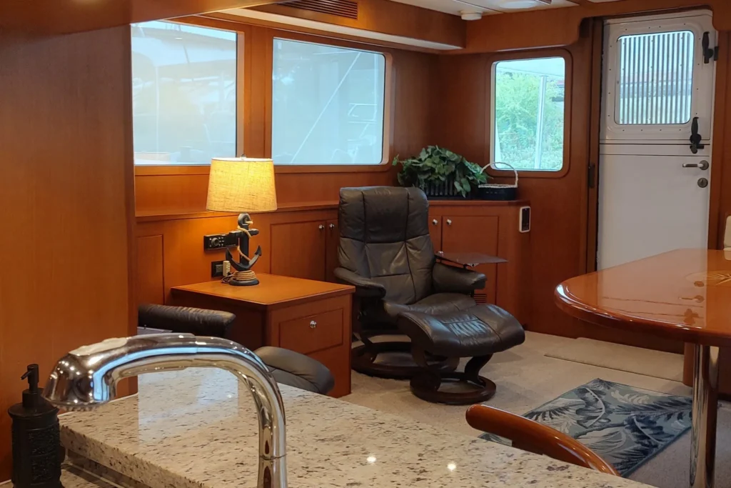 2017 Nordhavn 60 - REDEEMED 15 - Luxurious interior of a 2017 Nordhavn 60 yacht with leather chair and elegant decor.