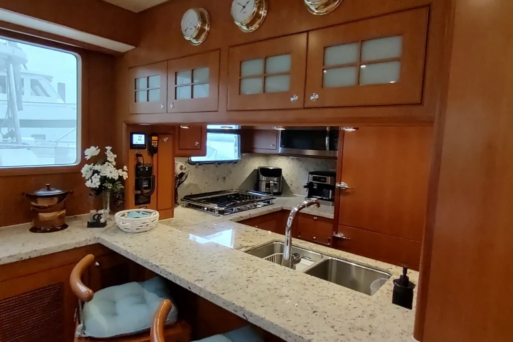 2017 Nordhavn 60 - REDEEMED 19 - Luxurious 2017 Nordhavn 60 yacht kitchen with granite countertops and modern appliances.