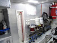 2017 Nordhavn 60 - REDEEMED 31 - The engine room of a 2017 Nordhavn 60 features fuel filters and a fire extinguisher.
