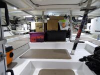 2017 Nordhavn 60 - REDEEMED 39 - The engine room of a 2017 Nordhavn 60 with steps, storage, and technical equipment.