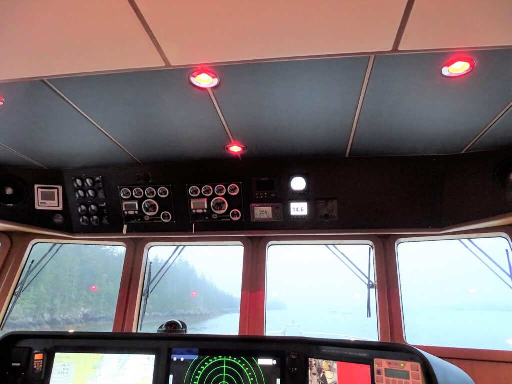 2017 Nordhavn 60 - REDEEMED 27 - The helm of a 2017 Nordhavn 60 with instruments and radar display.